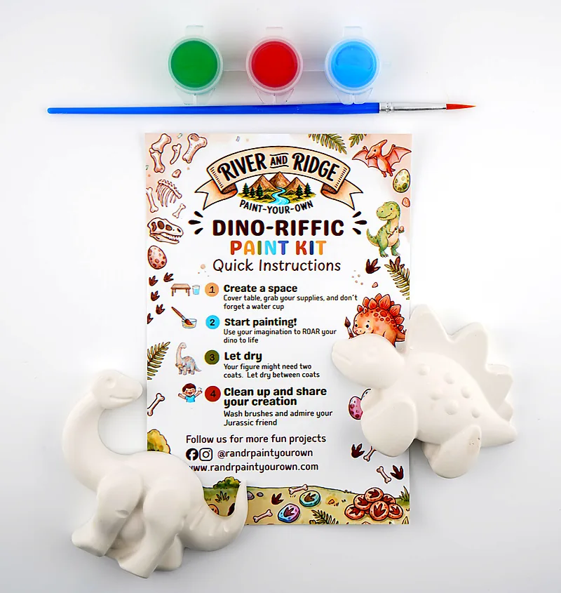 The Dino-riffic kit as it ships: a plaster stegosaurus and long-neck, three pots of paint and a brush, laid out with the printed instruction card.