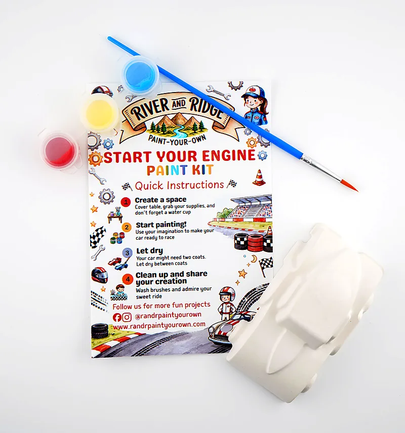The Start Your Engine kit as it ships: a plaster car, three pots of paint and a brush, laid out with the printed instruction card.